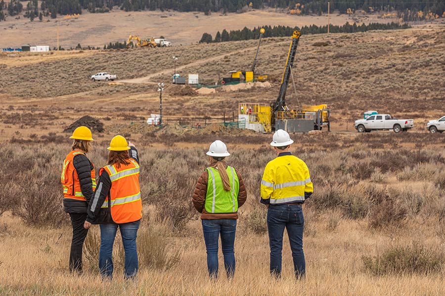 Black Butte Team Members Pointing at a Rig